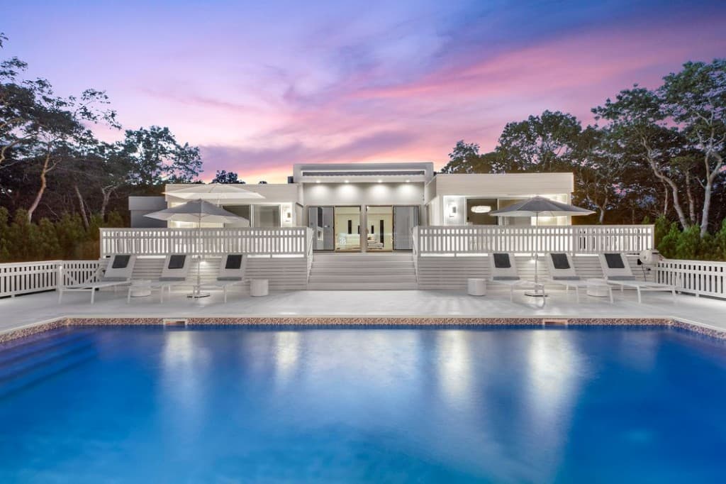 Luxury home with pool at sunset