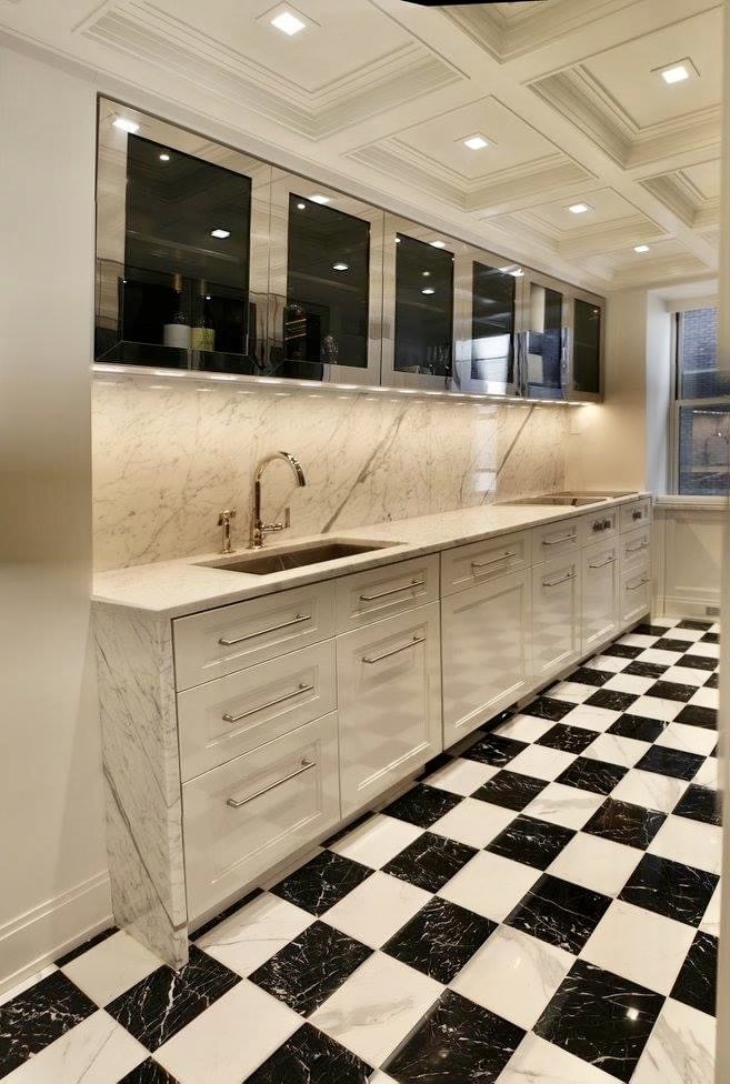 Pantry with white cabinetry, mirrored uppers, a coffered ceiling, and a checkered floor